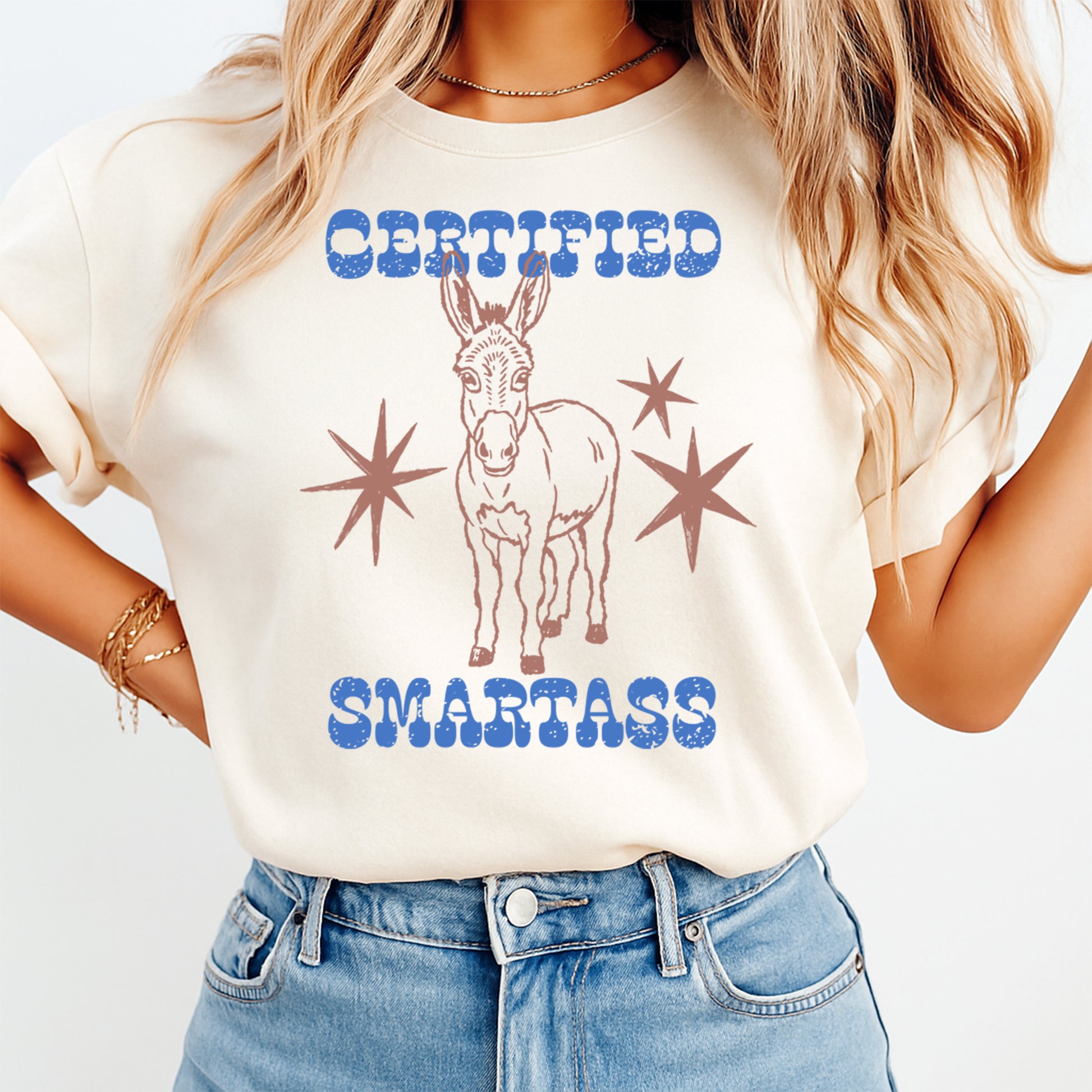 Person wearing a t-shirt with a donkey graphic and text on a plain background
