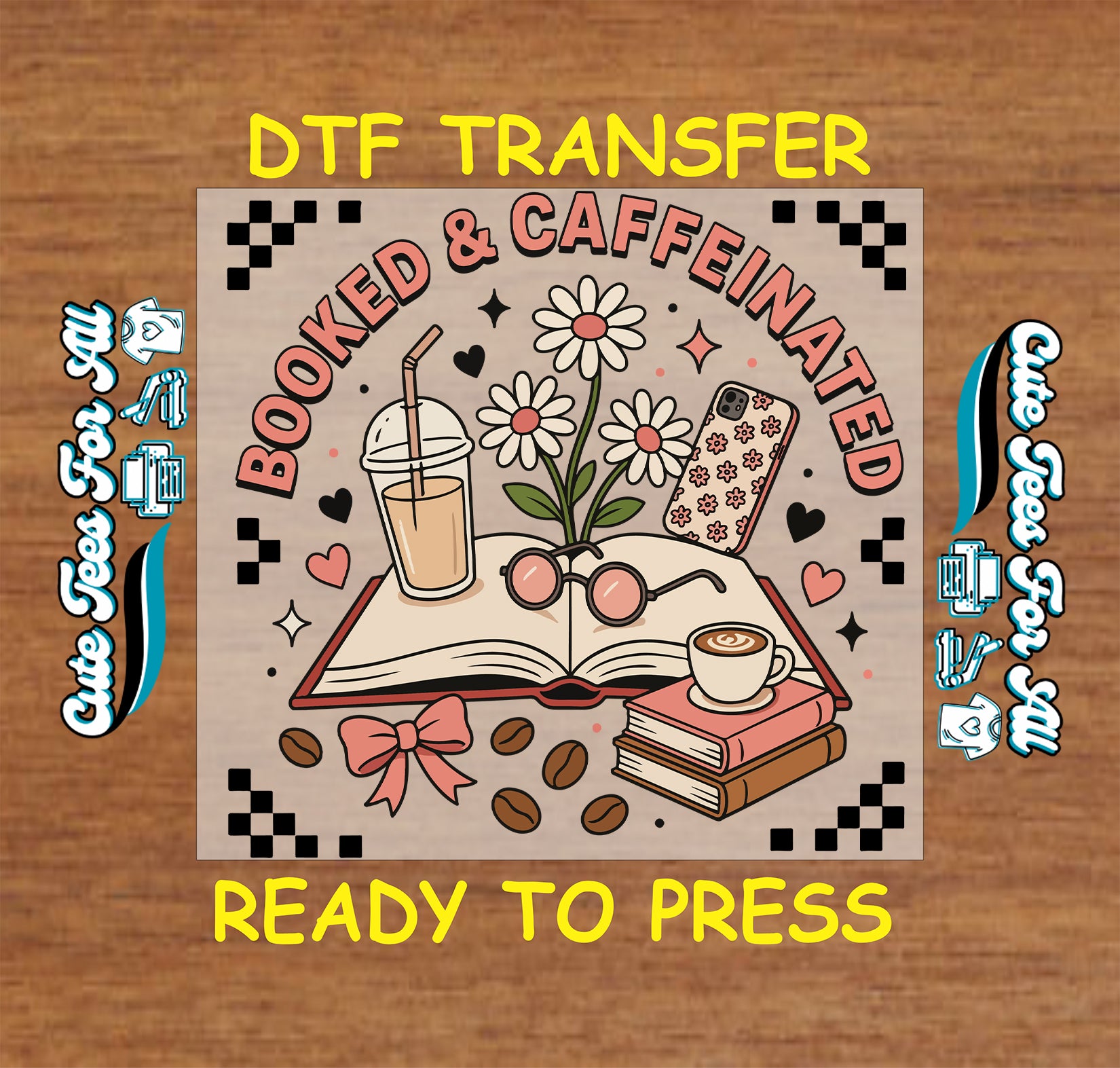 A DTF transfer design mockup on a wood background, featuring the text 'DTF TRANSFER' and 'READY TO PRESS' in yellow. The central design shows an open book with glasses, a coffee cup, flowers, coffee beans, and a phone, with the words 'BOOKED & CAFFEINATED' in pink arching over the illustration.
