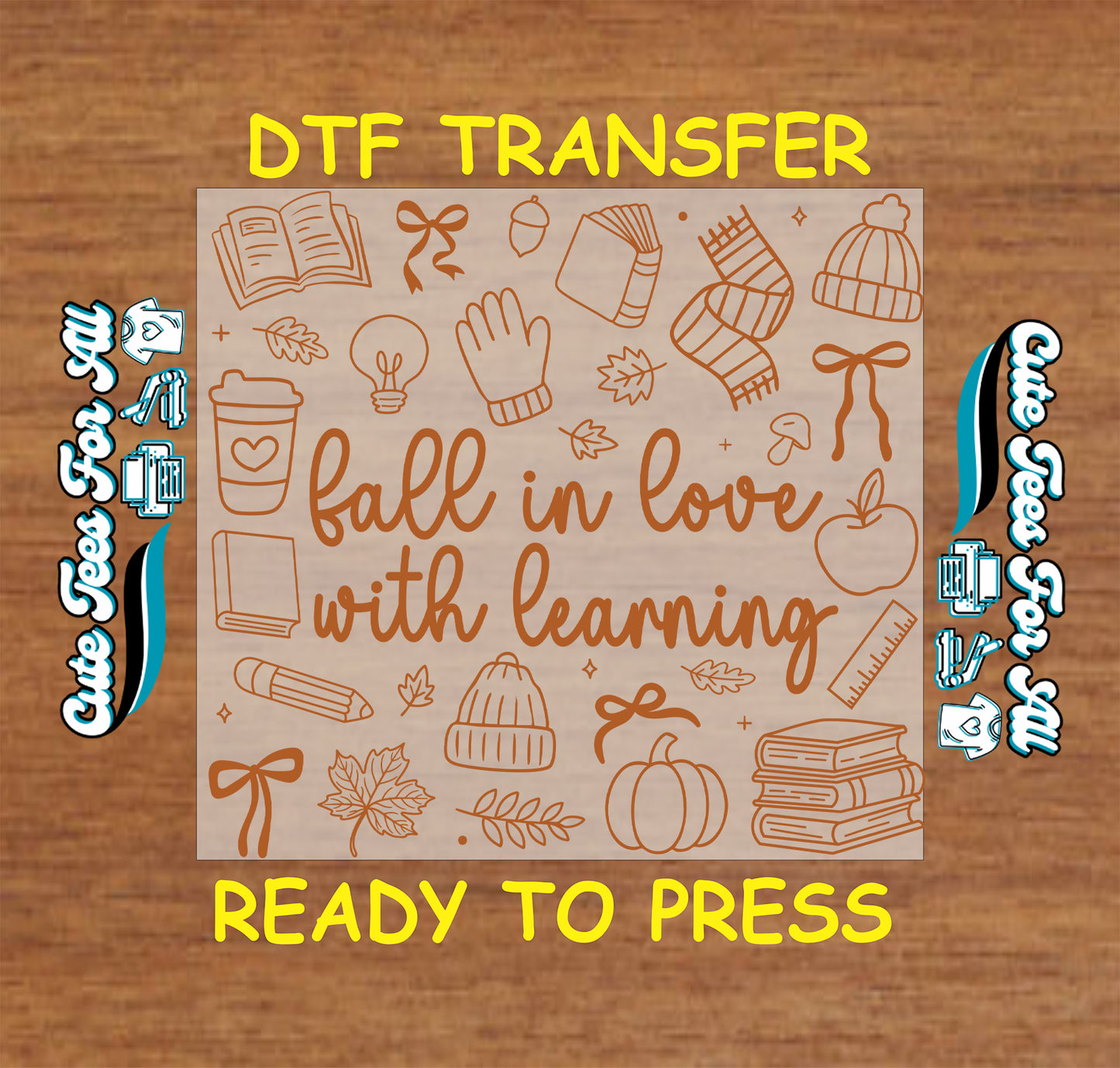 A DTF transfer design preview on a wood-grain background, featuring the text 'fall in love with learning' in brown script surrounded by autumn and school-themed illustrations like books, a pumpkin, leaves, and a beanie. Yellow text at the top and bottom reads 'DTF TRANSFER' and 'READY TO PRESS'.