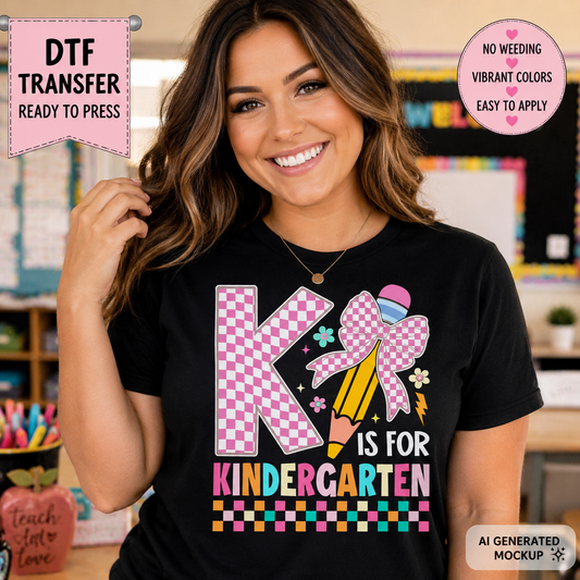 A smiling woman wearing a black graphic T-shirt with a colorful 'K is for Kindergarten' design, shown in a classroom-like setting. Promotional badges around the edges read 'DTF TRANSFER READY TO PRESS', 'NO WEEDING VIBRANT COLORS EASY TO APPLY', and 'AI GENERATED MOCKUP'.