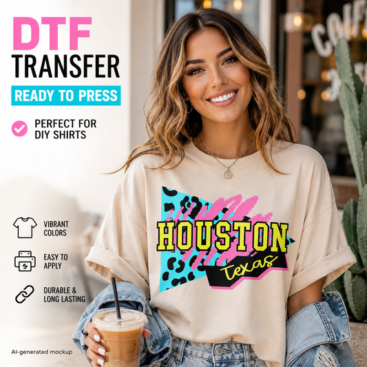 A smiling woman wearing a beige oversized T-shirt with a colorful 'Houston Texas' DTF transfer graphic, holding an iced coffee in front of a storefront. Text overlays on the left describe the transfer as ready to press and suitable for DIY shirts.