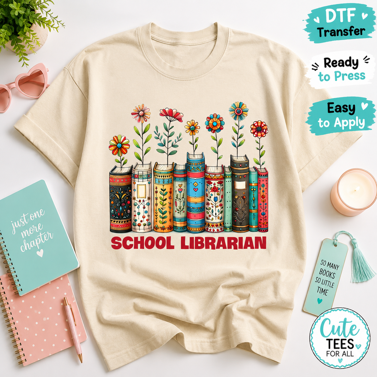 A flat-lay mockup of a cream-colored t-shirt featuring a colorful graphic of books with flowers growing out of them and the text 'SCHOOL LIBRARIAN' in red. The shirt is styled with various desk accessories and promotional badges for DTF transfer.