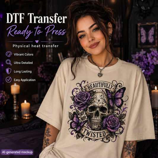 A woman wearing a cream-colored t-shirt with a detailed graphic print of a skull, purple roses, and butterflies with the text 'BEAUTIFULLY TWISTED'. The background is a dimly lit, moody room with candles and purple flowers.