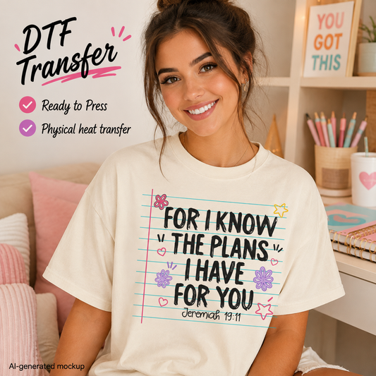 A woman wearing a cream-colored graphic t-shirt with a notebook-style design that reads 'FOR I KNOW THE PLANS I HAVE FOR YOU Jeremiah 19:11' in black text with pink, blue, and purple doodles. The image is a mockup with text overlays on the left side reading 'DTF Transfer' and 'Ready to Press' and 'Physical heat transfer'.