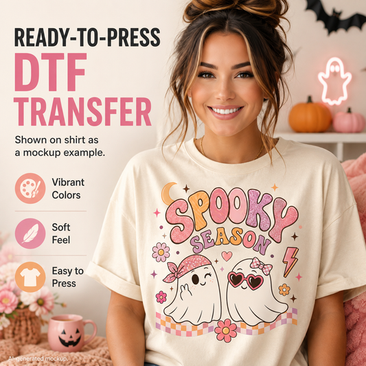 A smiling woman wearing a cream T-shirt with a colorful 'Spooky Season' graphic featuring two cartoon ghosts and flowers. The image includes marketing text reading 'READY-TO-PRESS DTF TRANSFER' and feature callouts like 'Vibrant Colors,' 'Soft Feel,' and 'Easy to Press.