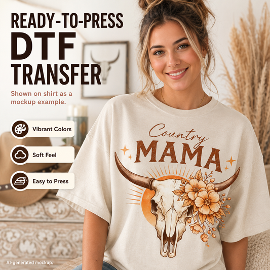 A woman wearing a cream-colored t-shirt with a 'Country Mama' bull skull and floral DTF transfer graphic, set in a cozy indoor environment with promotional text overlays on the left.