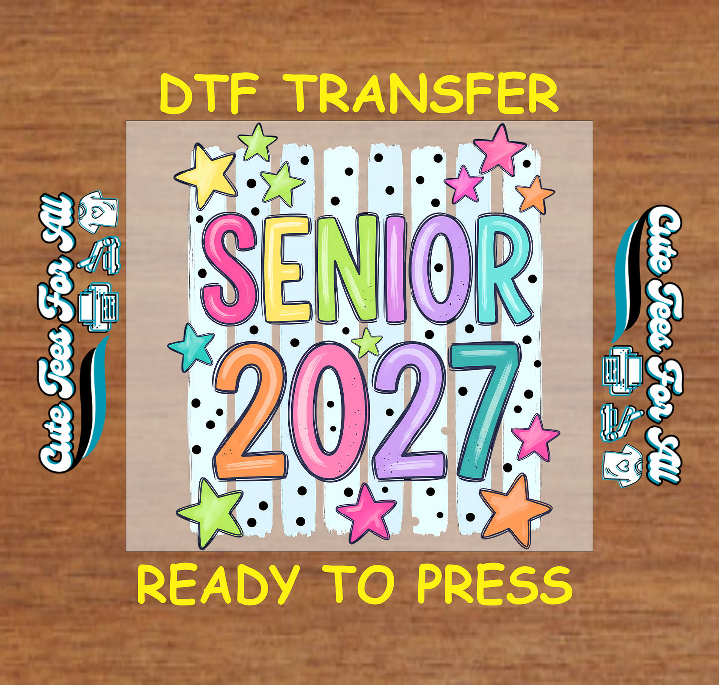 A DTF transfer sheet featuring the text 'SENIOR 2027' in colorful bubble letters with stars on a white striped background, displayed on a wood surface with 'DTF TRANSFER' and 'READY TO PRESS' text.