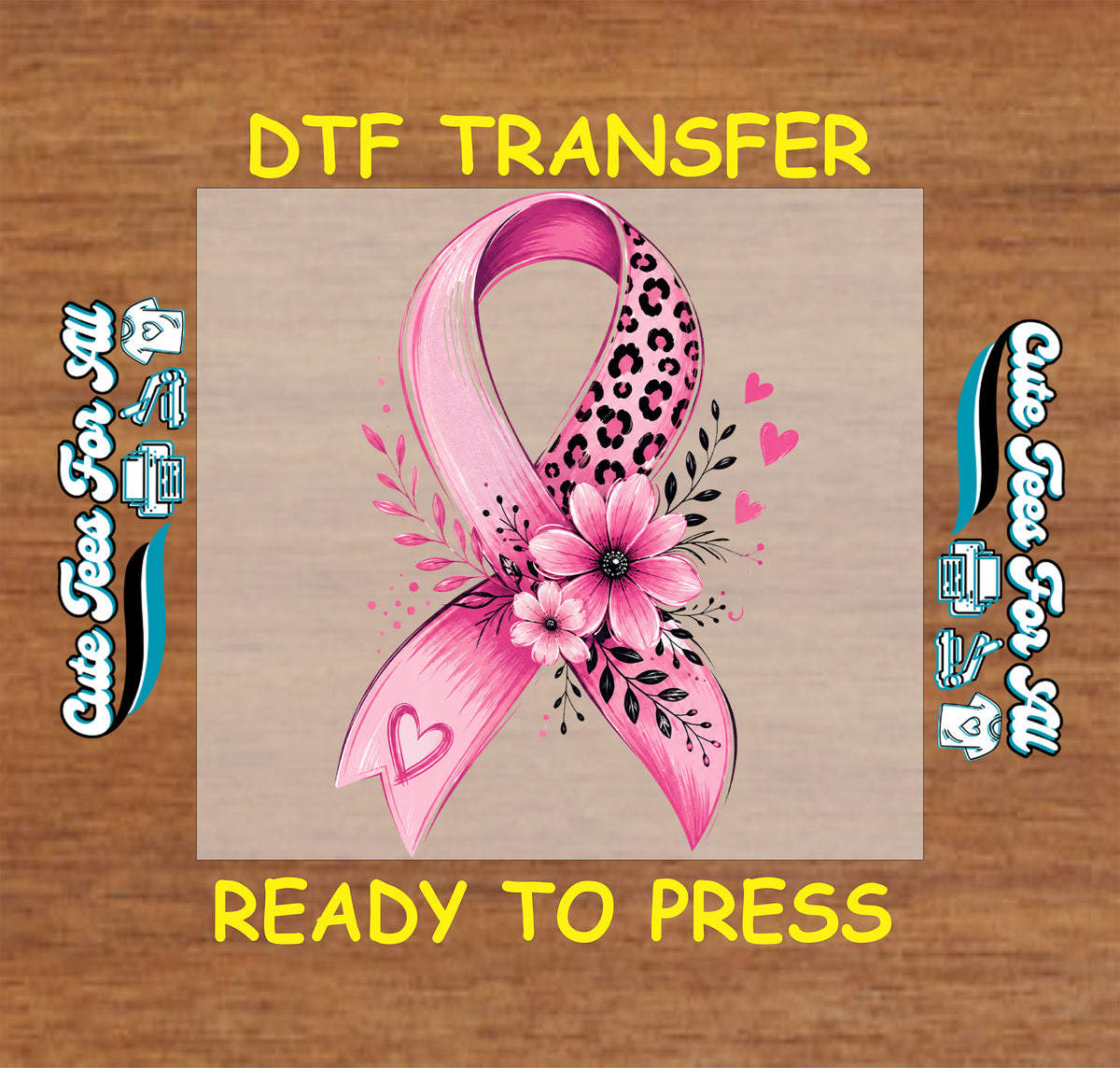 Woman wearing a gray T-shirt featuring a pink breast cancer awareness ribbon with leopard print, flowers, hearts, and greenery.