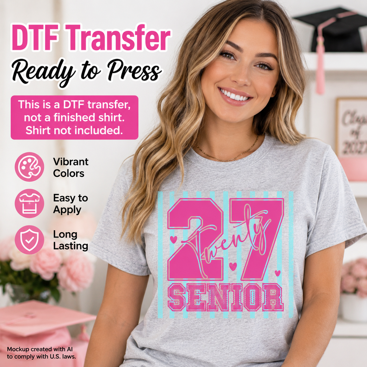 Woman wearing a gray T-shirt featuring a pink and aqua Senior 27 graduation design with large numbers, Twenty script lettering, stripes, and heart accents.