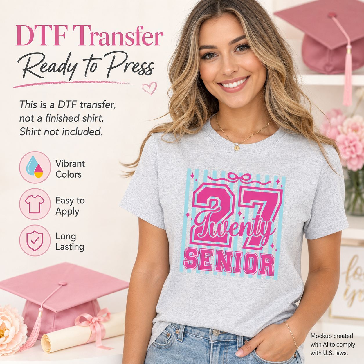 Woman wearing a gray T-shirt featuring a pink and aqua Senior 27 graduation design with large numbers, Twenty script lettering, vertical stripes, and sparkle accents.