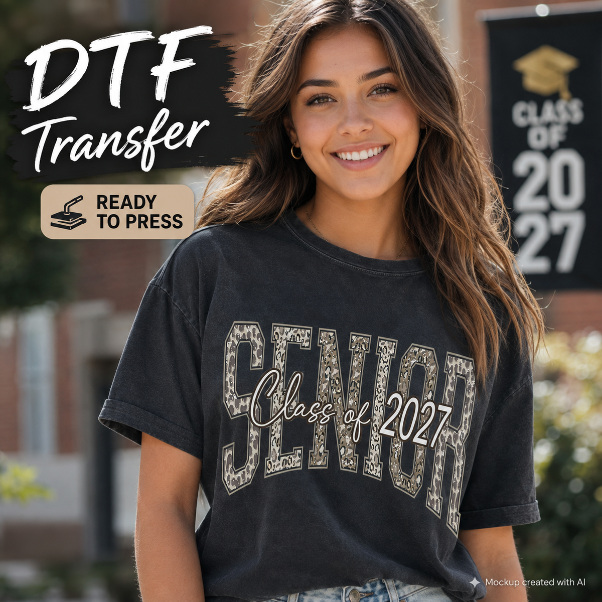 A smiling young woman outdoors wearing a dark charcoal gray graphic T-shirt with 'SENIOR Class of 2027' printed across the front. Large overlaid text at the top left reads 'DTF Transfer' and 'READY TO PRESS,' with a graduation banner in the background.