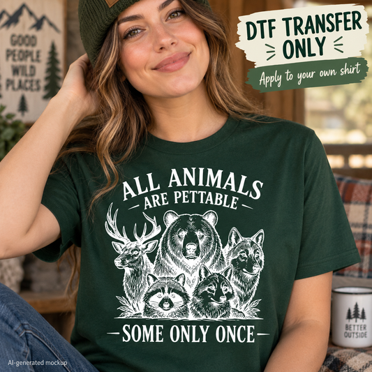 All Animals Are Pettable DTF transfer mockup featuring bear, deer, wolf, fox, and raccoon wildlife artwork on a dark green T-shirt.