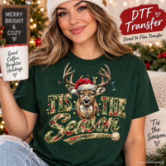 A woman wearing a dark green Christmas-themed t-shirt with a deer graphic and 'Tis the Season' text, holding a mug in a cozy holiday setting. The image includes promotional text overlays for 'DTF Transfer'.