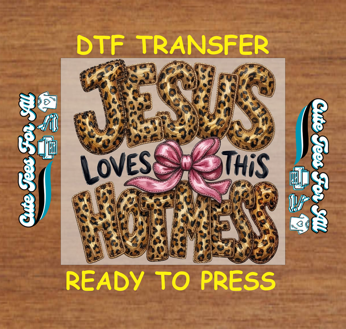A DTF transfer design preview featuring the text 'JESUS LOVES THIS HOTNESS' in leopard print and black lettering with a pink bow graphic, centered on a wood background with 'DTF TRANSFER' and 'READY TO PRESS' text.
