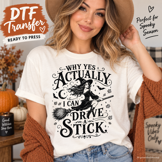 Woman wearing a cream Halloween shirt featuring a witch riding a broom with bats, stars, moon details and the phrase Why Yes Actually I Can Drive a Stick as a DTF transfer mockup.