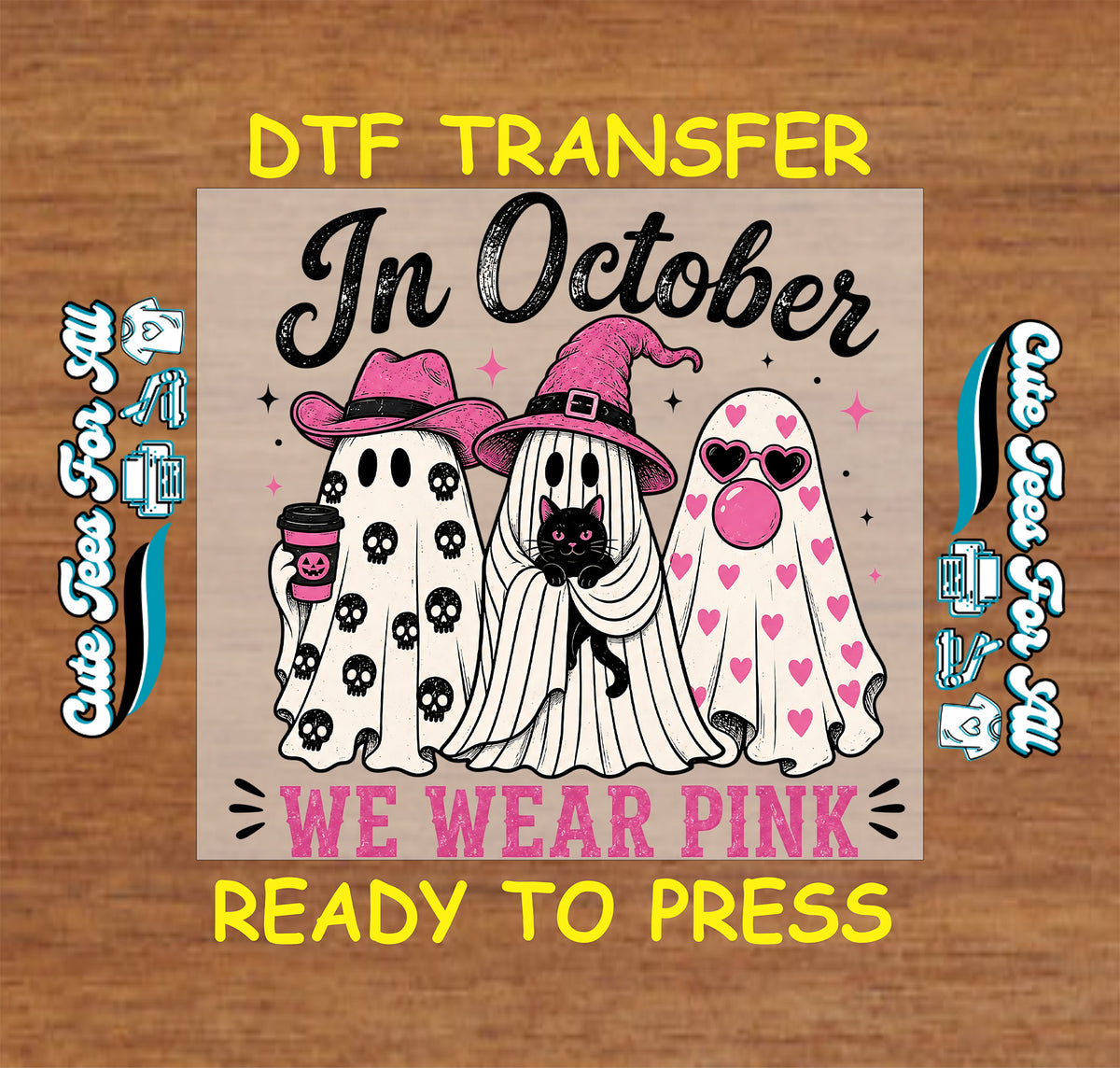A DTF transfer design preview on a wood background. The central square graphic shows three cartoon ghosts in white with pink accents: one with black skulls, one with a pink witch hat and a black cat, and one with pink hearts.