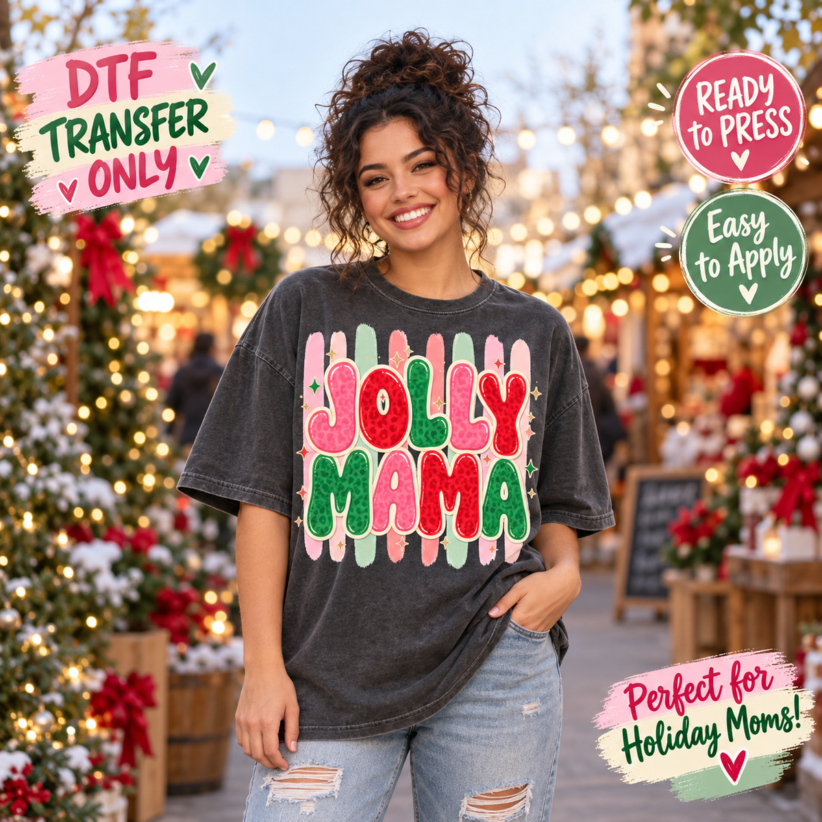 A woman wearing a dark gray washed t-shirt with a colorful 'Jolly Mama' DTF transfer graphic, standing in a festive holiday outdoor setting decorated with Christmas trees and lights. Text overlays on the corners highlight product features like 'DTF Transfer Only', 'Ready to Press', and 'Easy to Apply'.