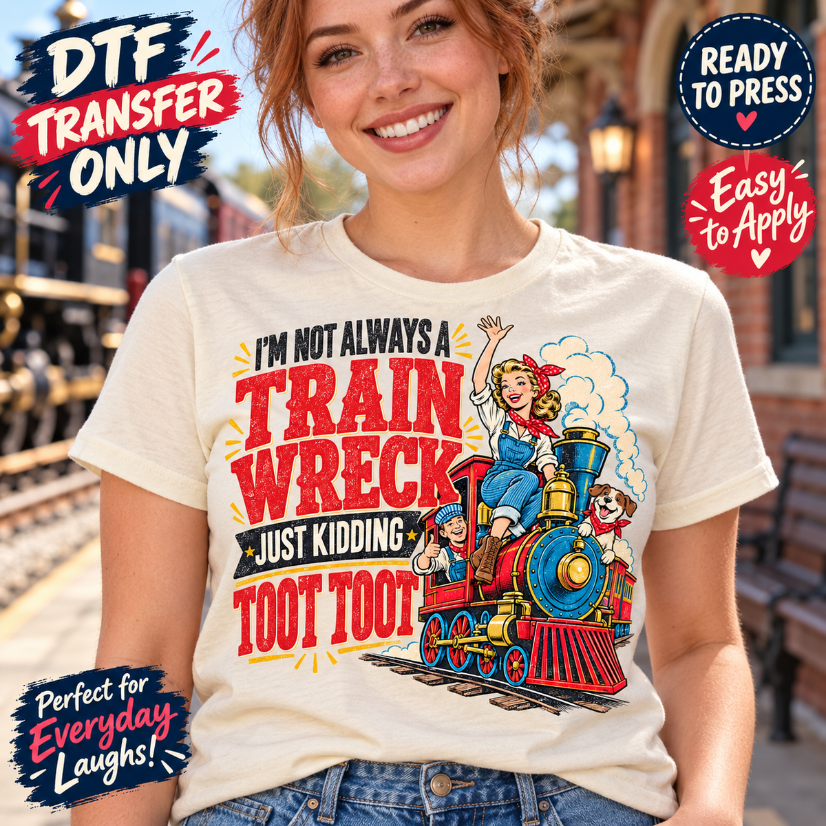 Woman in a cream tee modeling the funny Train Wreck DTF design with a colorful retro train and Just Kidding Toot Toot lettering.
