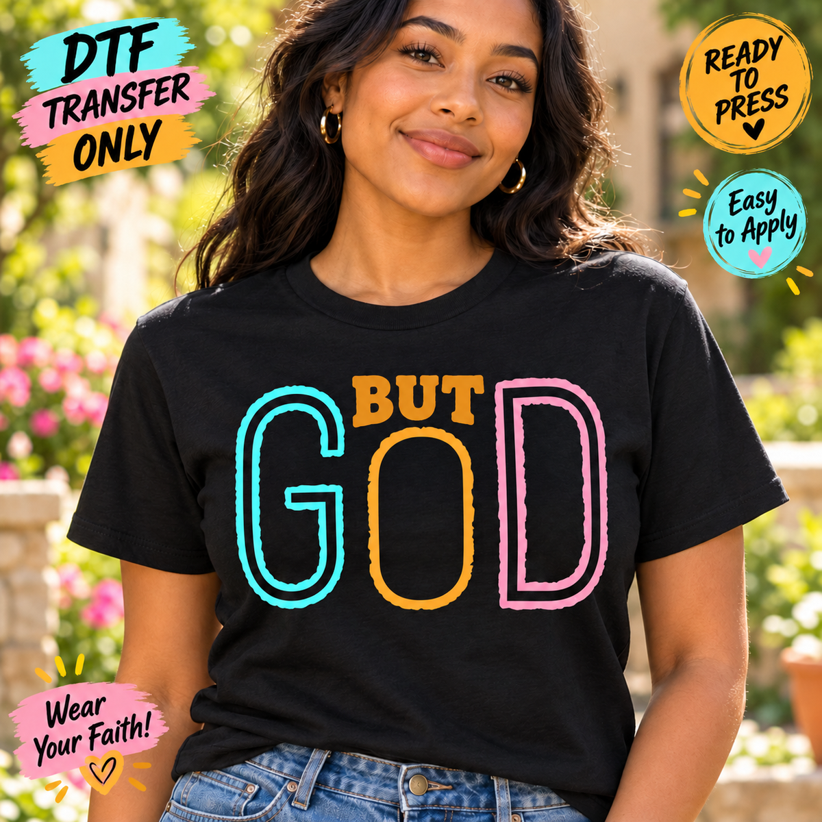 Woman in a black tee modeling But God DTF lettering in turquoise, golden yellow, and pink.