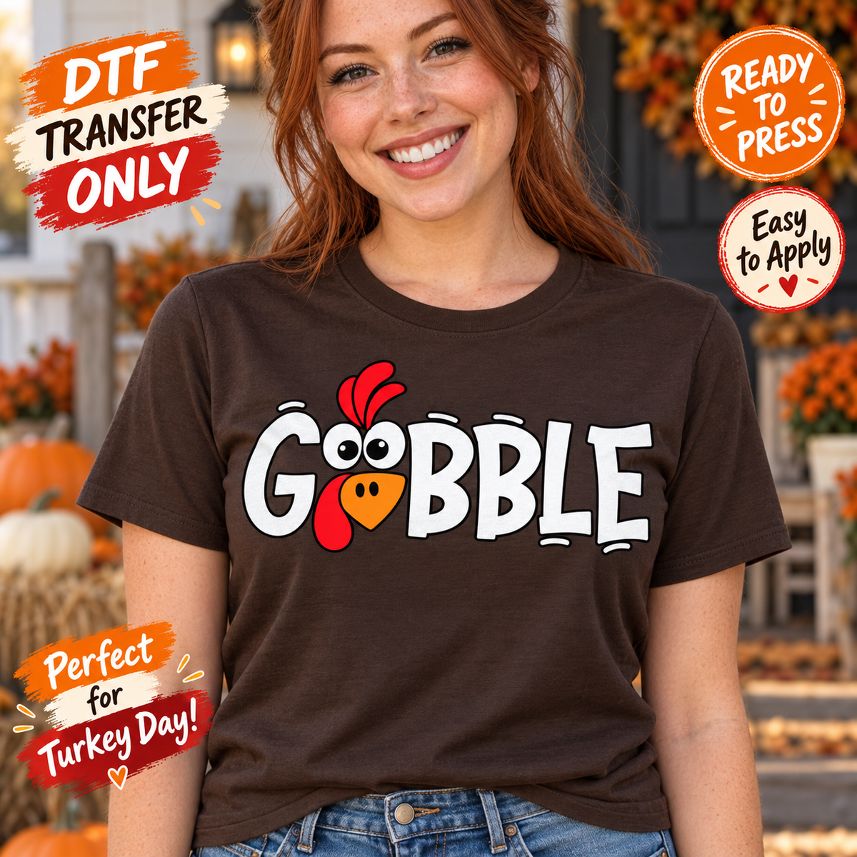 Woman in a brown tee modeling white Gobble DTF lettering with cartoon turkey eyes, an orange beak, and a red wattle.