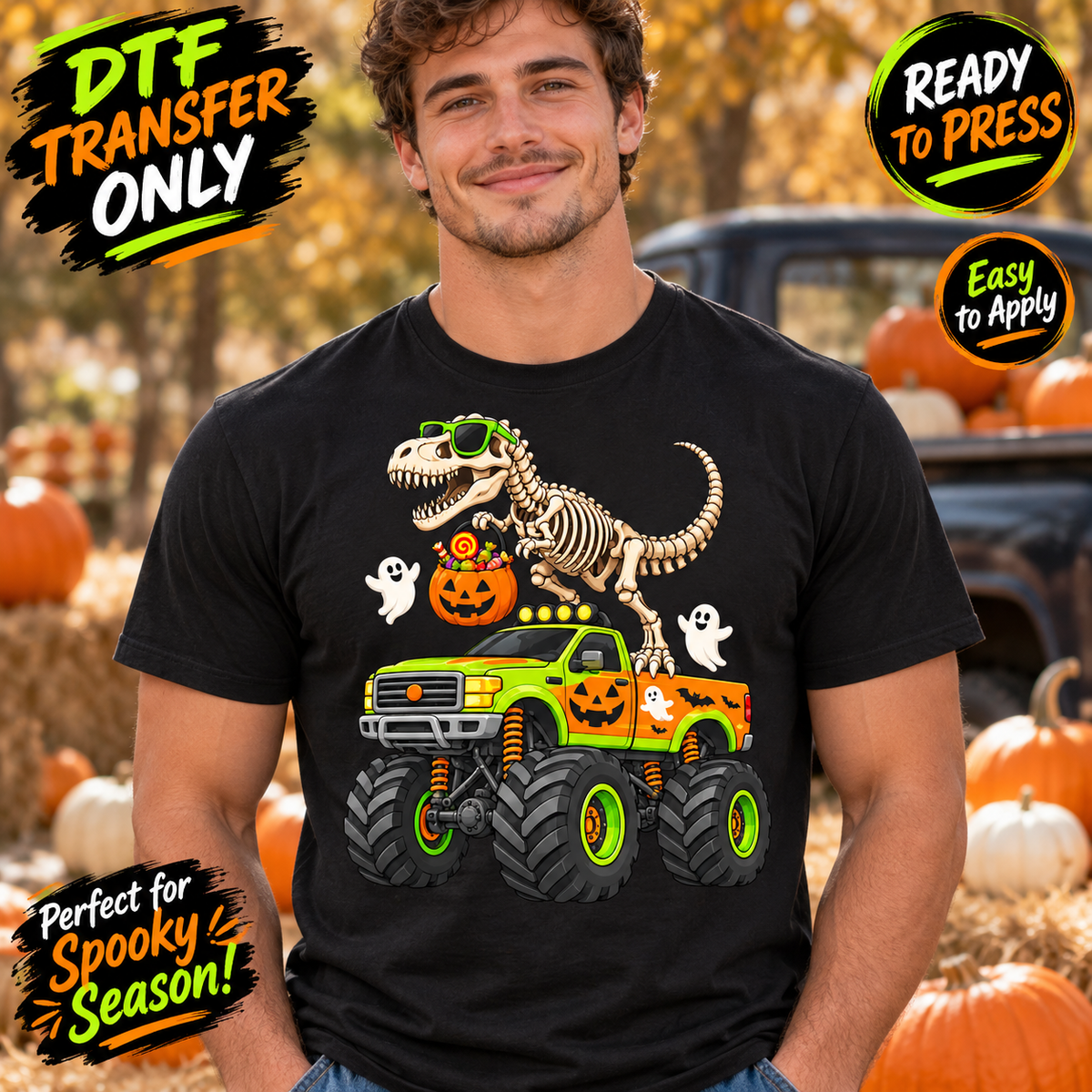Man in a black tee modeling Halloween DTF artwork with a skeleton T-Rex on a green and orange monster truck, friendly ghosts, and a candy pumpkin.