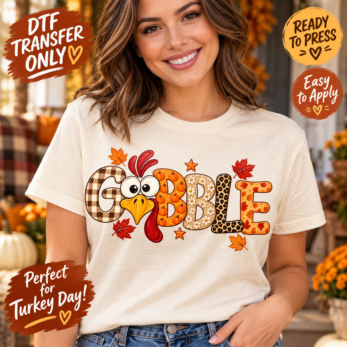 Woman modeling a cream shirt with Gobble patchwork lettering, a cartoon turkey face, pumpkins, leopard accents and fall leaves; Thanksgiving DTF mockup.