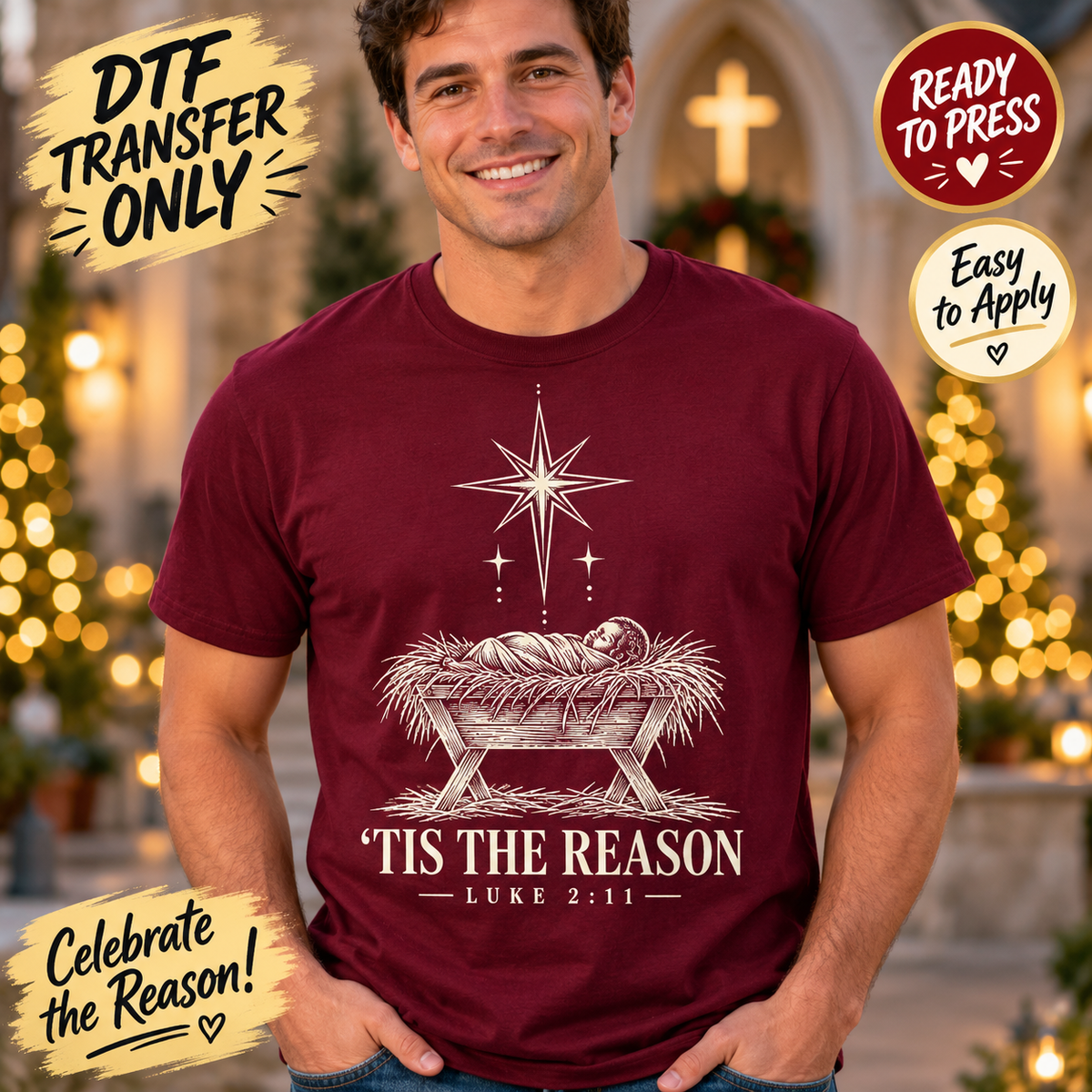 Man modeling a maroon shirt with white line-art baby Jesus in a manger, a star and 'Tis the Reason with Luke 2:11 text; Christmas DTF transfer mockup.
