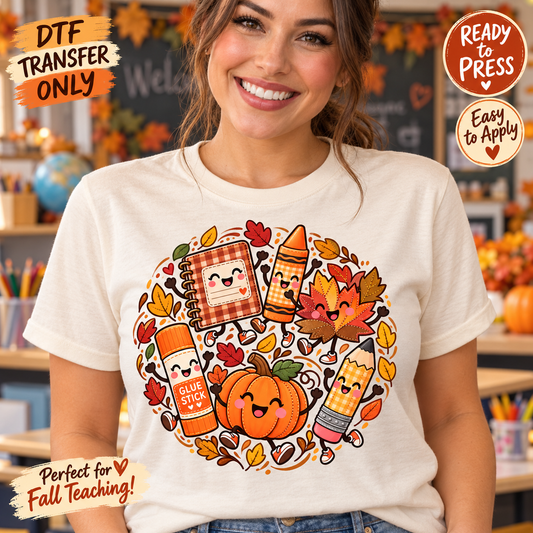 Woman modeling a cream shirt with smiling notebook, crayon, glue stick and pencil characters alongside a turkey, pumpkin and leaves; fall teacher DTF mockup.