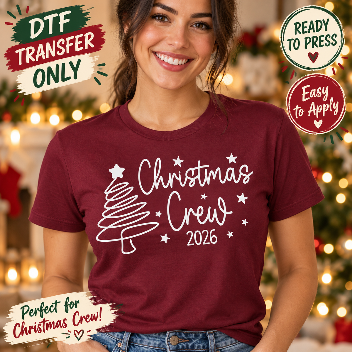 Woman in a maroon shirt displaying white Christmas Crew 2026 script with a stylized tree and stars.