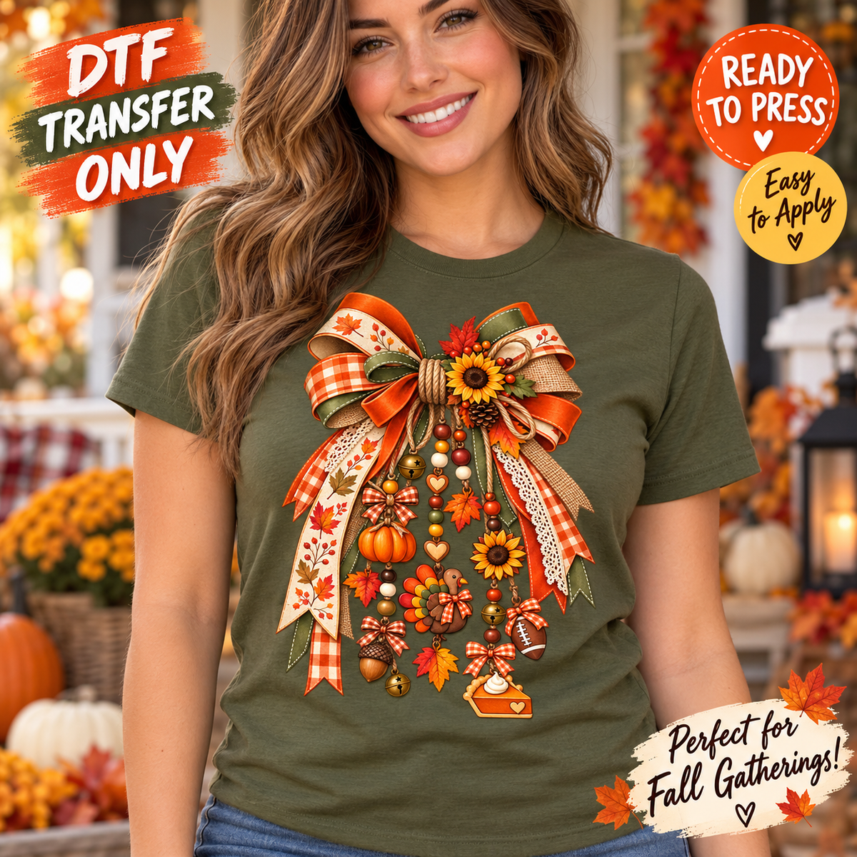 Woman in an olive shirt displaying a large patterned fall bow with pumpkins, sunflowers, and hanging harvest accents.