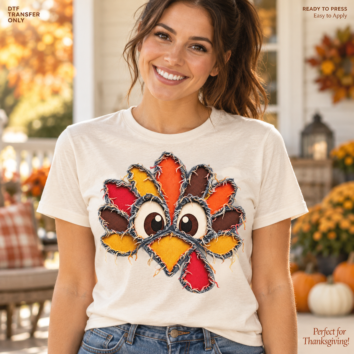 Lifestyle mockup of a woman wearing a cream shirt showing Wide-eyed turkey face with colorful patchwork-style feathers and stitched outlines. DTF transfer only; shirt not included.