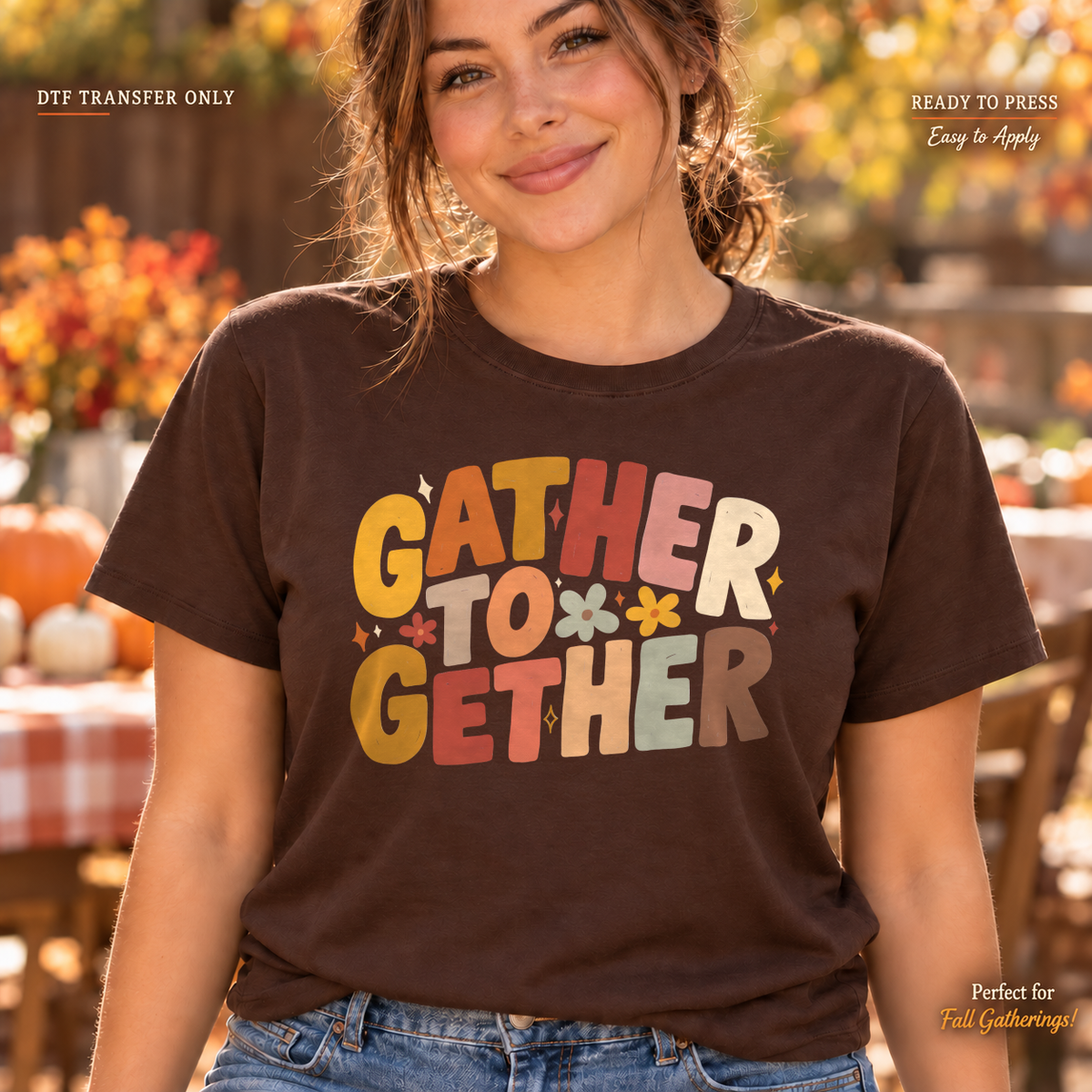 Lifestyle mockup of a woman wearing a brown shirt showing Gather Together in warm yellow, orange, and cream retro block lettering with a small flower. DTF transfer only; shirt not included.