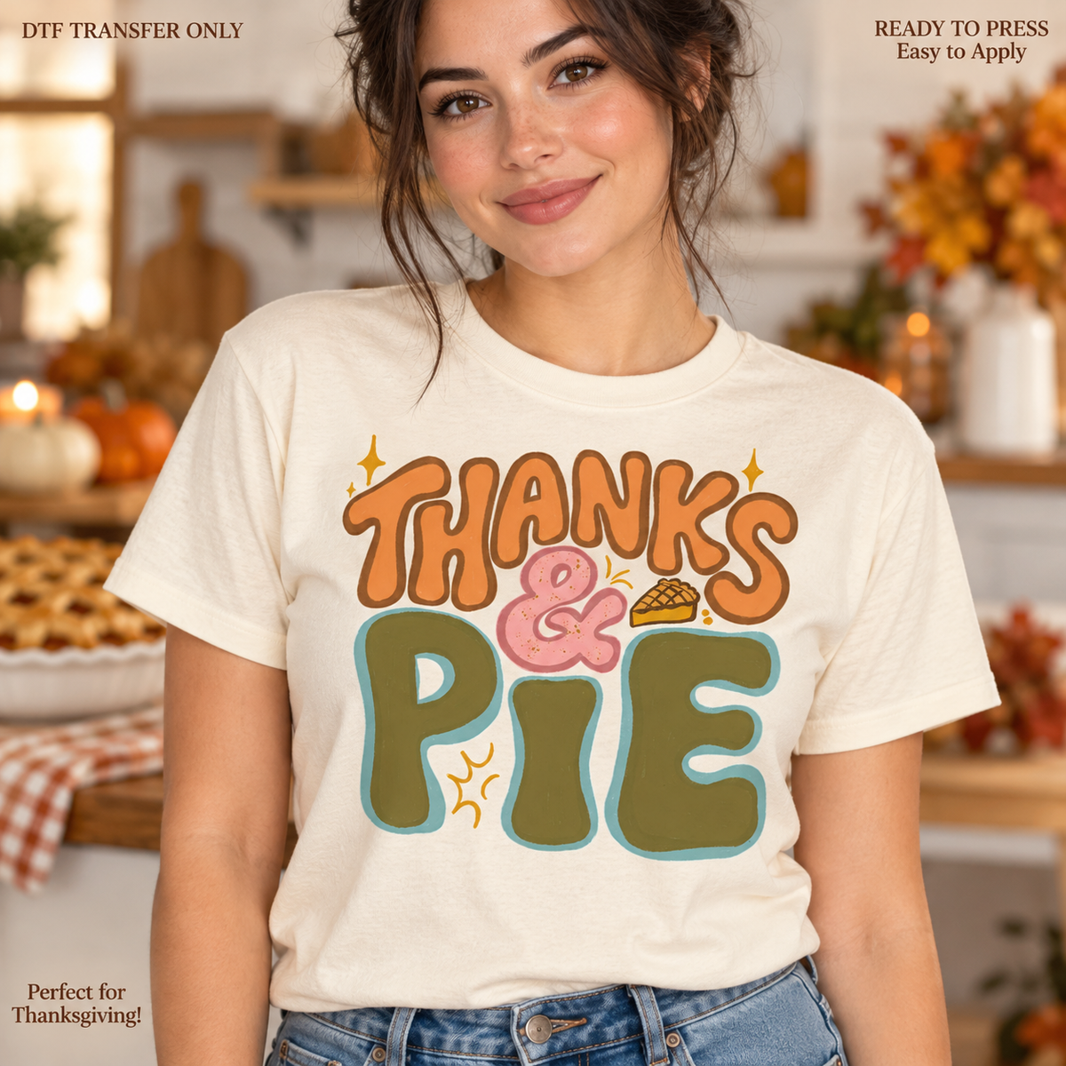 Lifestyle mockup of a woman wearing a cream shirt showing Thanks and Pie in retro orange, pink, and green lettering with a pie slice. DTF transfer only; shirt not included.