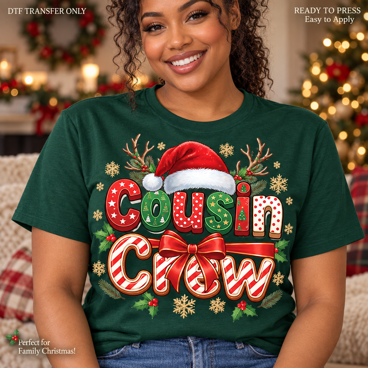 Lifestyle mockup of a woman wearing a dark green shirt showing Cousin Crew Christmas lettering with Santa hat, candy-cane stripes, bow, and antlers. DTF transfer only; shirt not included.