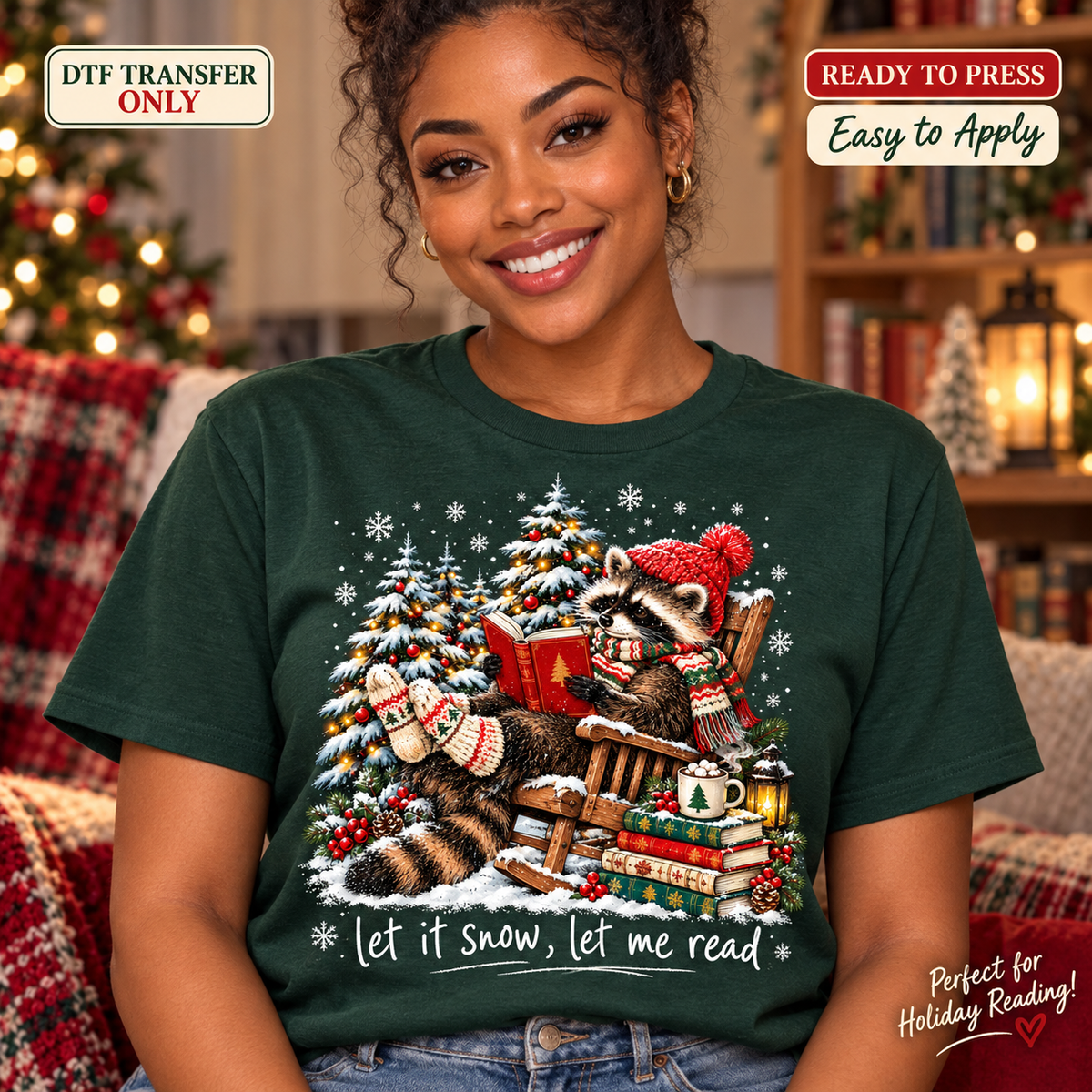 Lifestyle mockup of a woman wearing a dark green shirt showing Raccoon reading in a rocking chair beside snowy Christmas trees above Let It Snow Let Me Read. DTF transfer only; shirt not included.