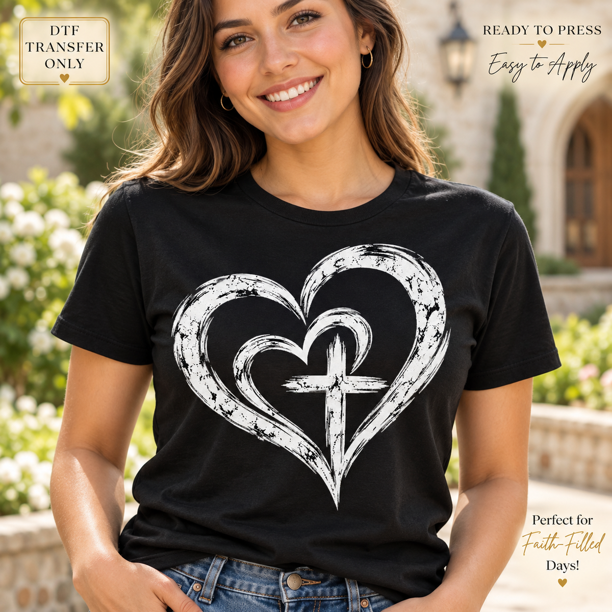 Lifestyle mockup of a woman wearing a black shirt showing White brush-style nested hearts surrounding a cross. DTF transfer only; shirt not included.