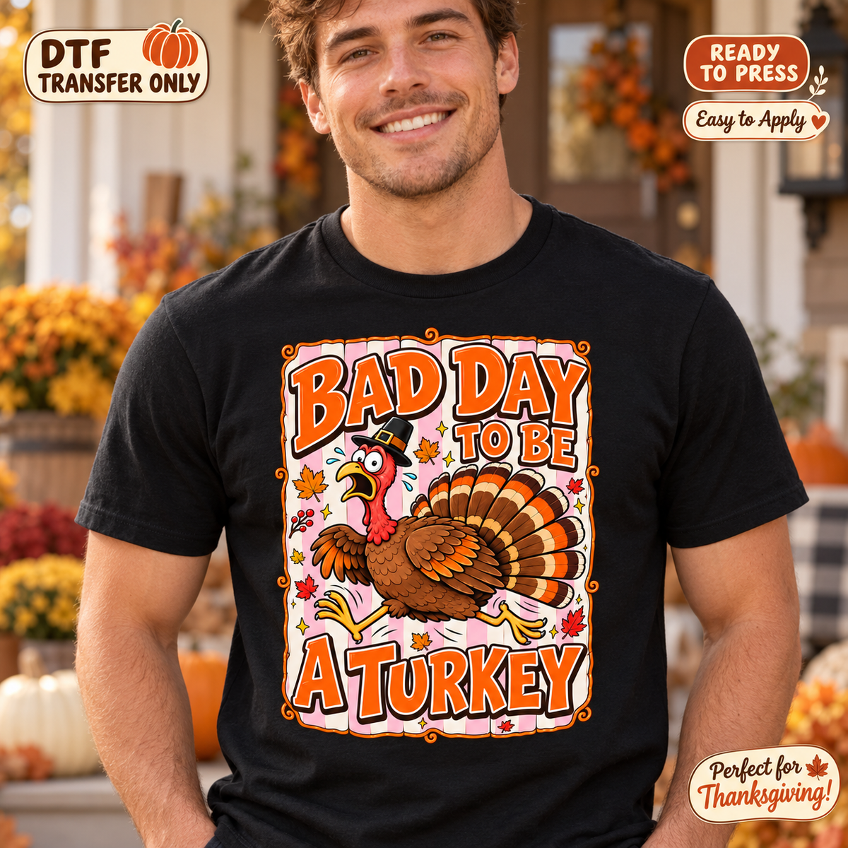 Lifestyle mockup of a man wearing a black shirt showing Bad Day to Be a Turkey lettering with a startled turkey and fall leaves. DTF transfer only; shirt not included.