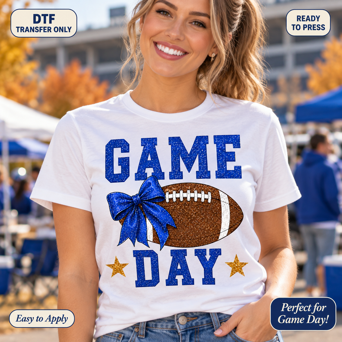 Lifestyle mockup of a woman wearing a white shirt showing Blue Game Day lettering with a football, blue bow, and gold stars in a printed sparkle style. DTF transfer only; shirt not included.