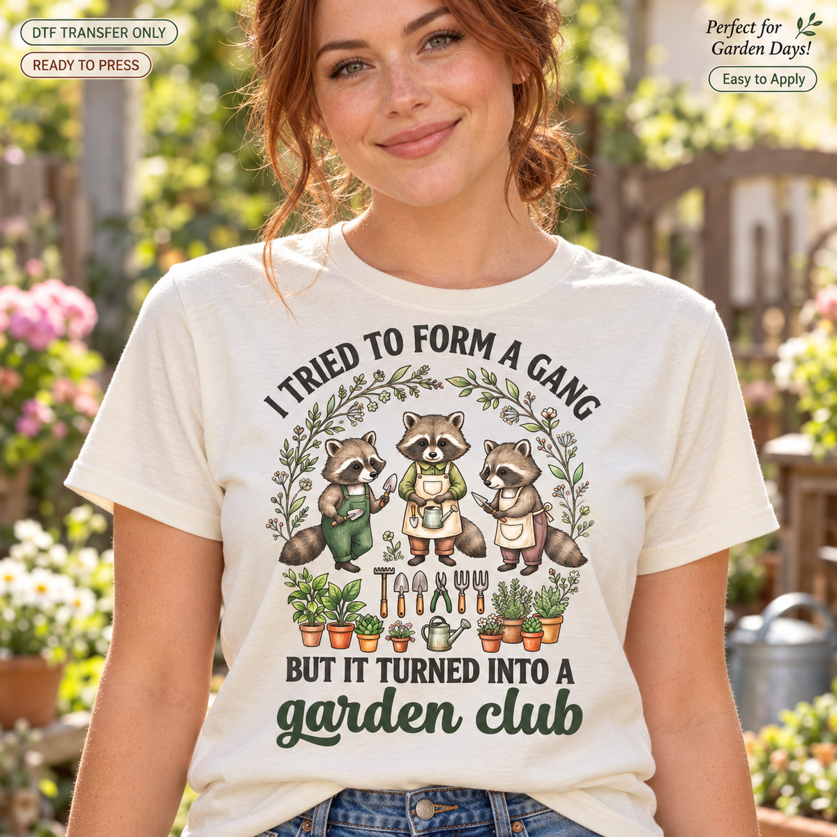 Woman wearing a cream shirt with raccoons and the phrase I Tried to Form a Gang but It Turned Into a Garden Club.