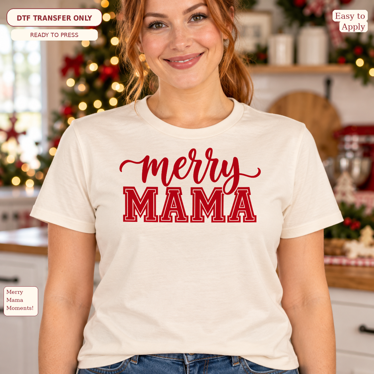 Woman wearing a cream tee with red merry script above large red MAMA lettering in a Christmas setting.
