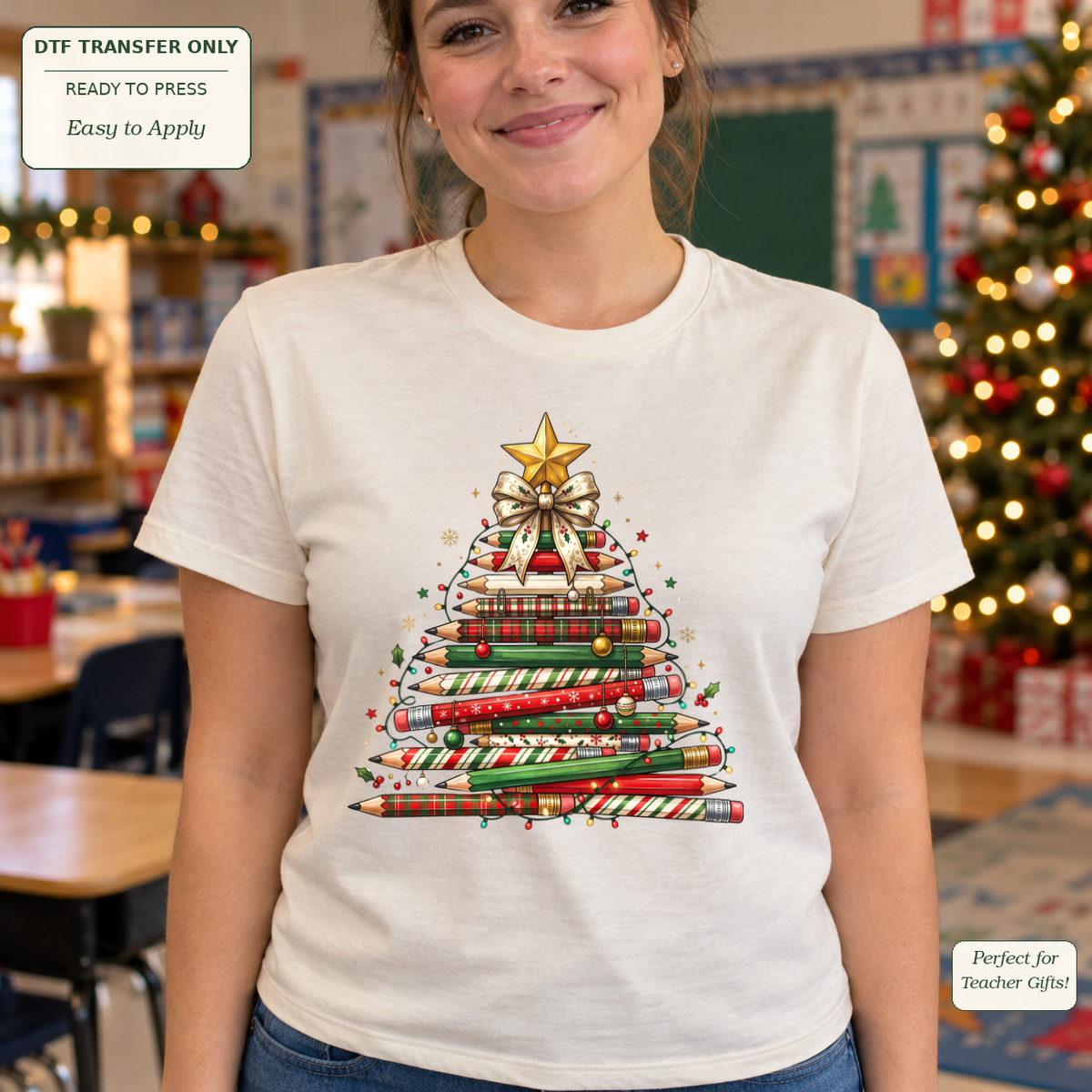Woman in a cream tee with a Christmas tree made of patterned red and green pencils, ornaments, a bow and a gold star.