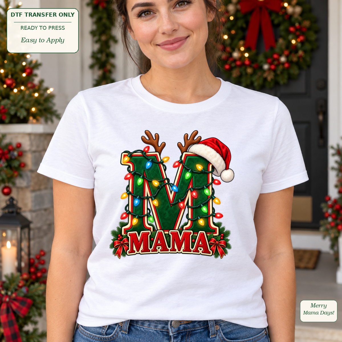 Woman wearing a white tee with a large green M, MAMA lettering, reindeer antlers, a Santa hat and Christmas lights.