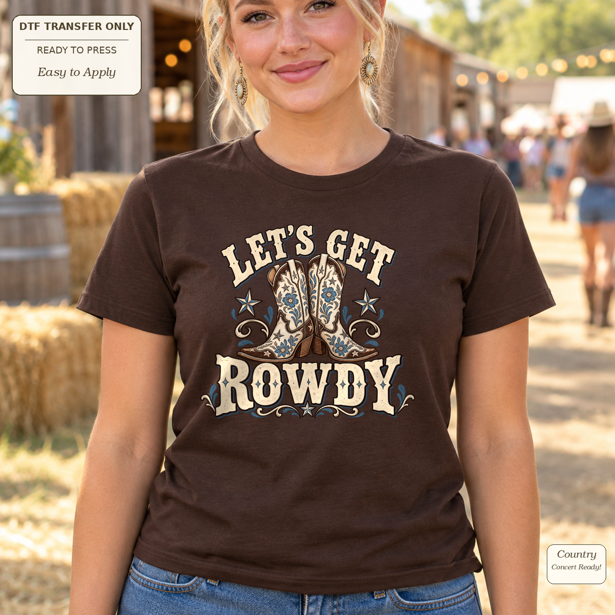 Woman wearing a brown tee with cream Let’s Get Rowdy lettering and decorative cowboy boots.