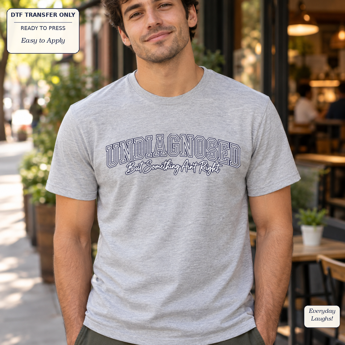 Man wearing a gray tee with outlined UNDIAGNOSED lettering and But Something Ain’t Right script.