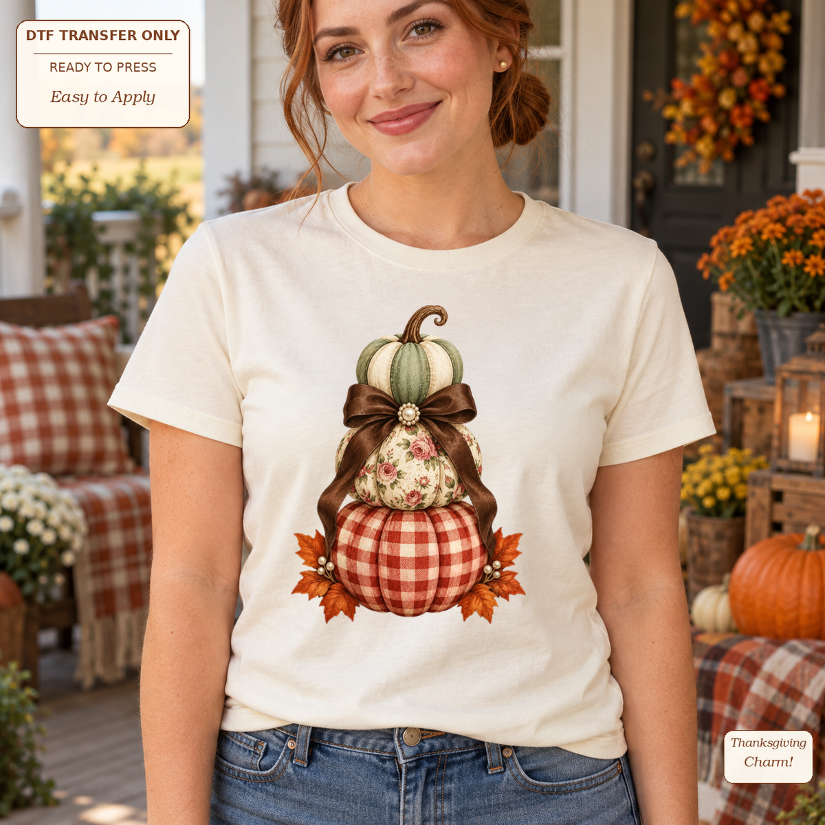 Woman wearing a cream tee with stacked green, floral and gingham pumpkins tied with a large brown bow.