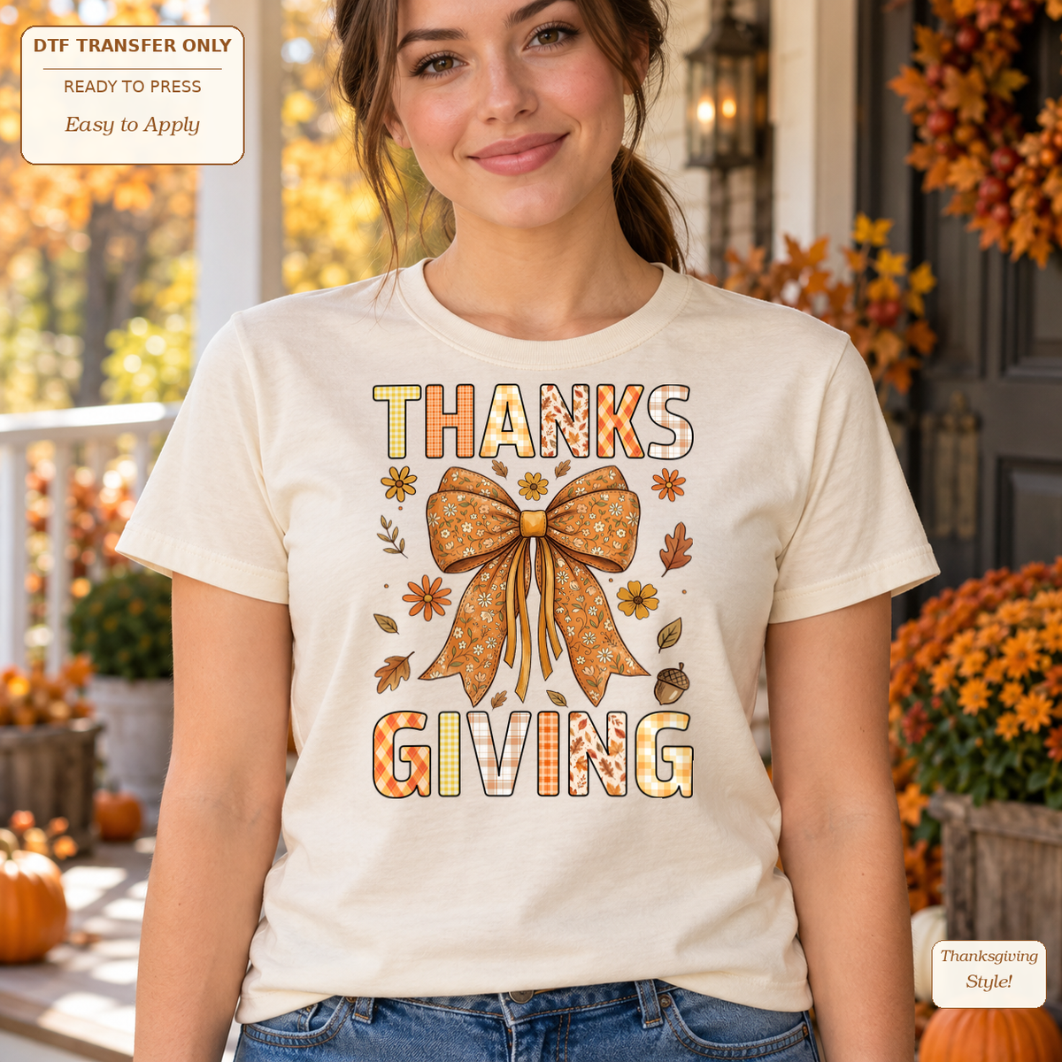 Woman wearing a cream tee with THANKS and GIVING lettering separated by a large autumn-colored bow.