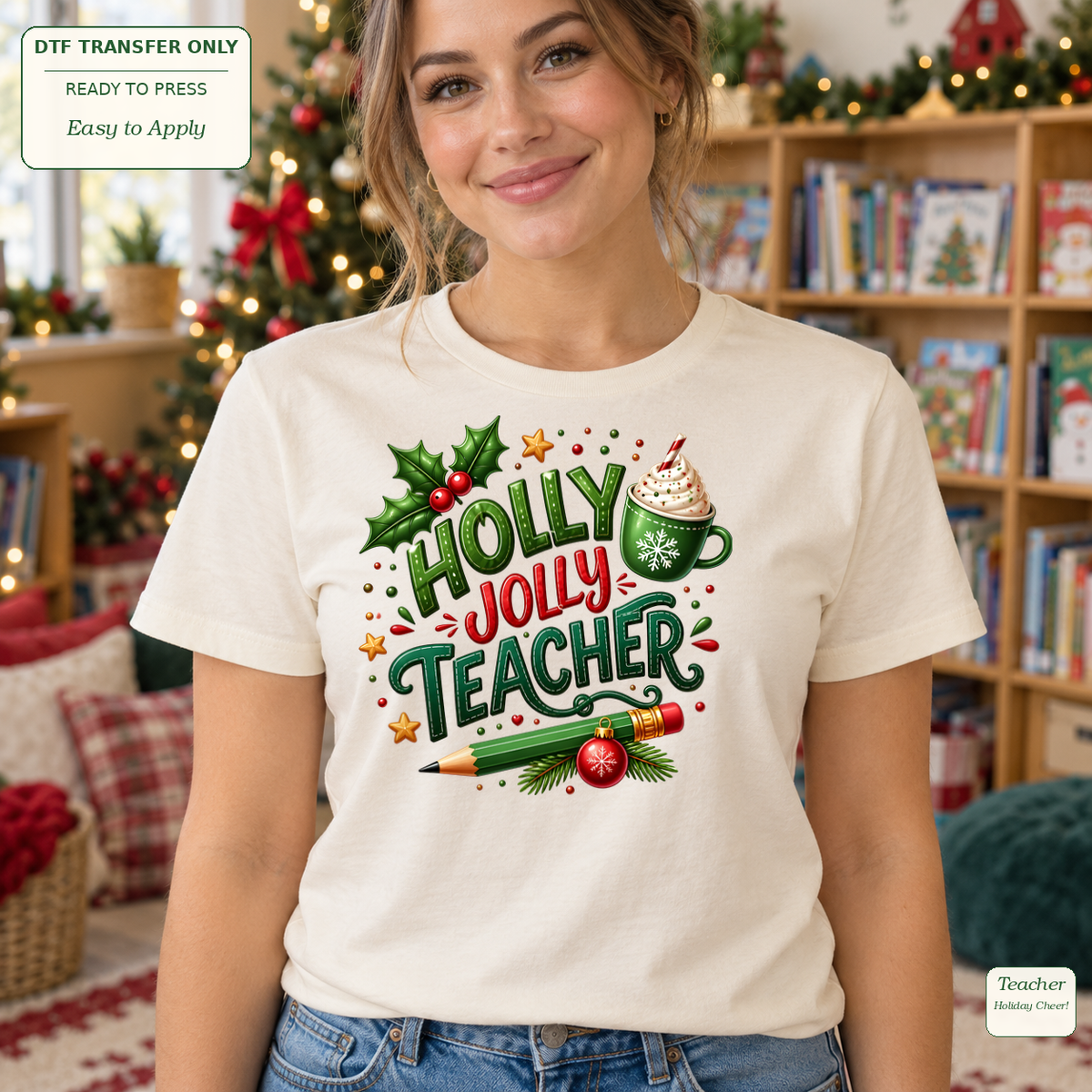 Woman wearing a cream tee with Holly Jolly Teacher lettering, a green pencil, holly and a festive drink.