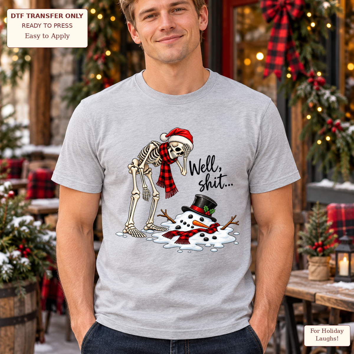 Man wearing a gray tee with a festive skeleton looking at a melted snowman beside Well, shit text.