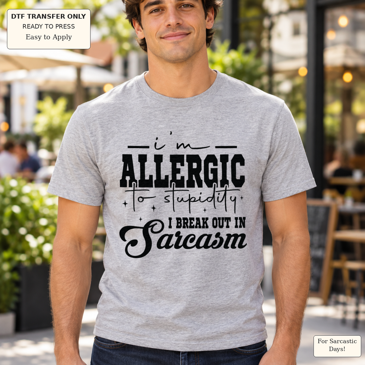 Man wearing a gray tee with black I’m allergic to stupidity I break out in Sarcasm lettering.