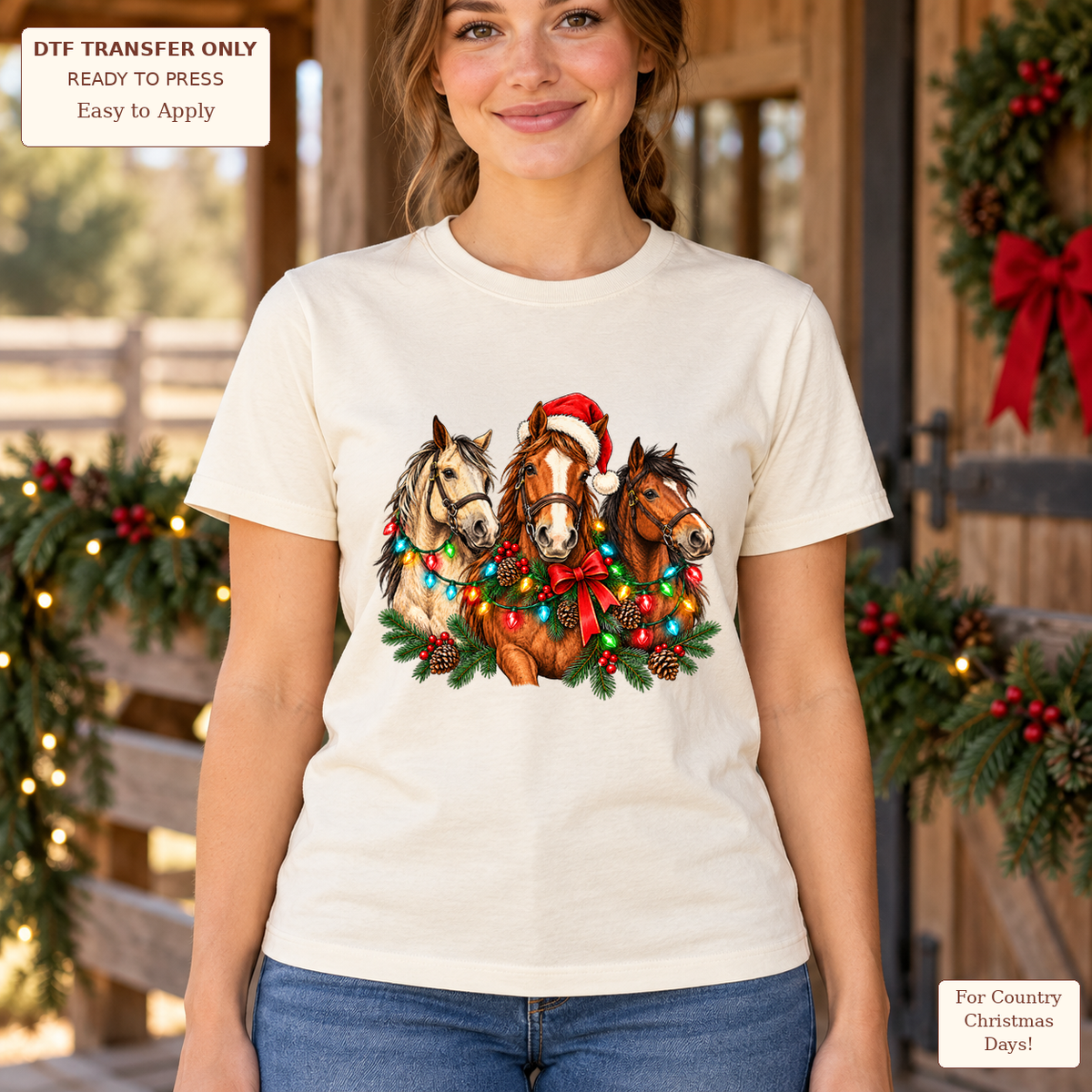 Woman wearing a cream tee with three horses decorated with Christmas lights, greenery and a Santa hat.